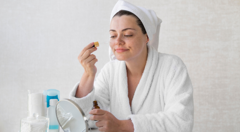 “Woman applying face serum after skincare routine for glowing and radiant skin”